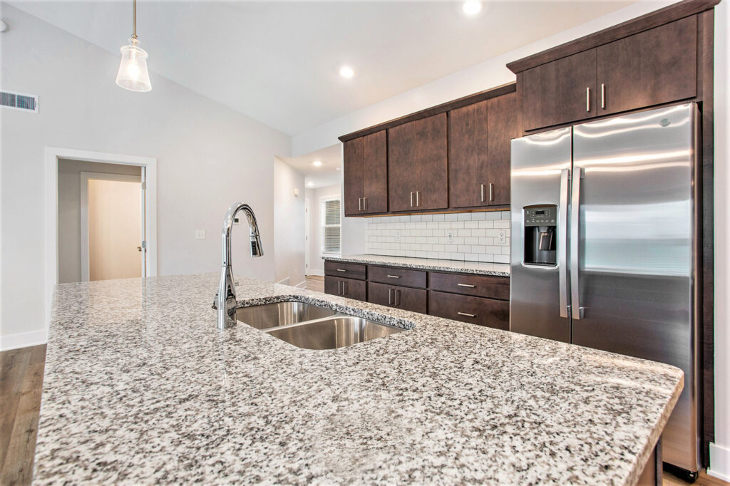 Spacious kitchen with stainless steel appliances and granite countertops