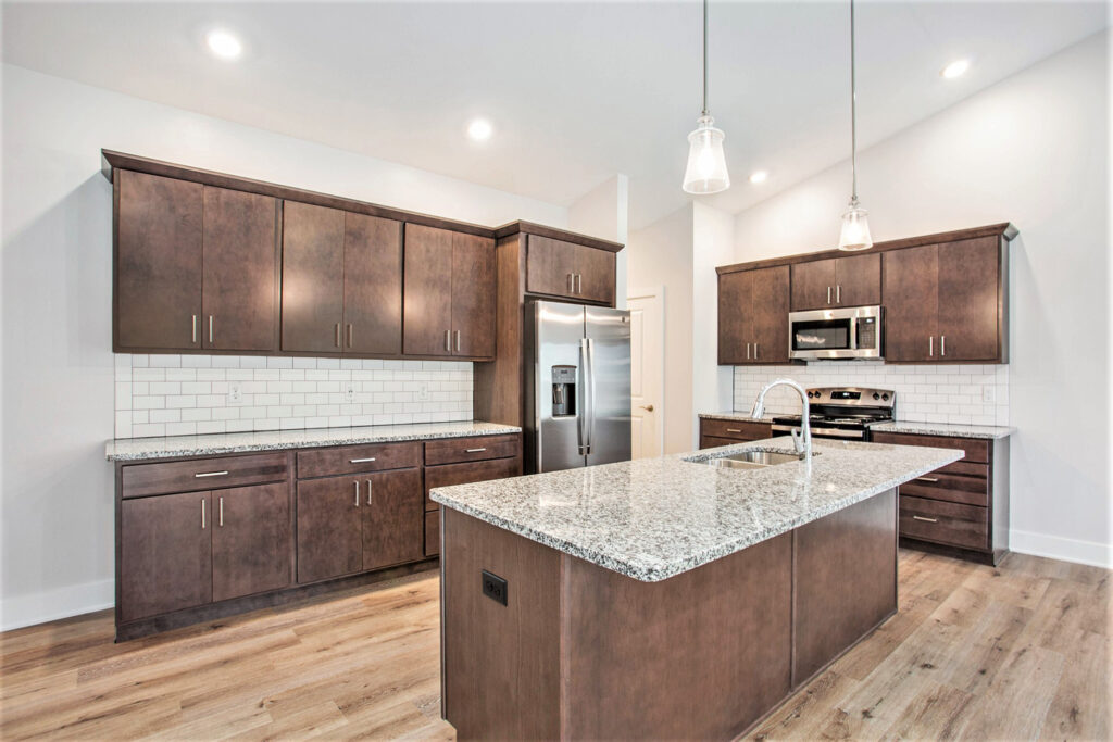 Spacious kitchen with stainless steel appliances and granite countertops